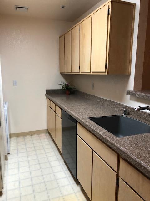 1410 Bel Air Drive, Unit 304 Concord, CA 94521 - Photo 14 of 23 a kitchen with a sink a cabinets and window