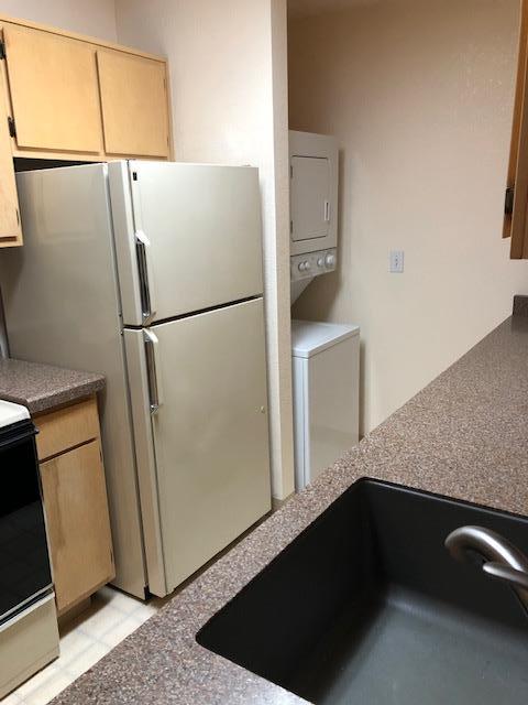 1410 Bel Air Drive, Unit 304 Concord, CA 94521 - Photo 15 of 23 a white refrigerator freezer sitting inside of a kitchen