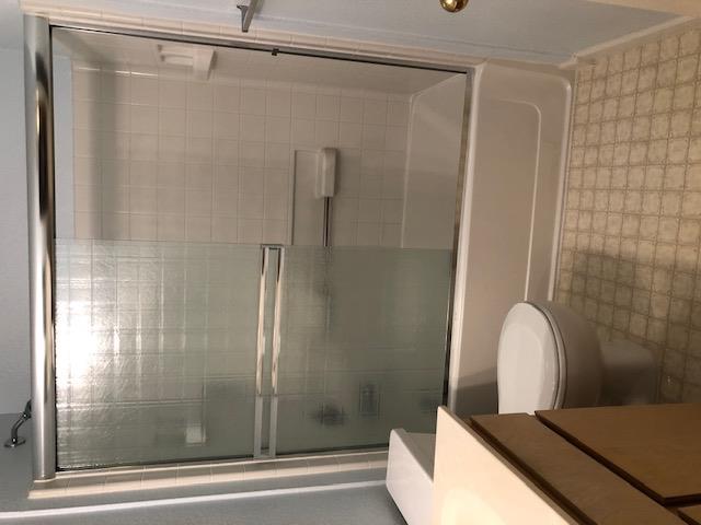 1410 Bel Air Drive, Unit 304 Concord, CA 94521 - Photo 17 of 23 a bathroom with a shower and a sink