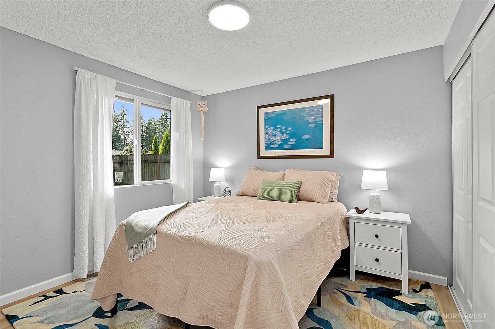 26104 195th Place Southeast Covington, WA 98042 - Photo 18 of 29 a bedroom with a bed and a window