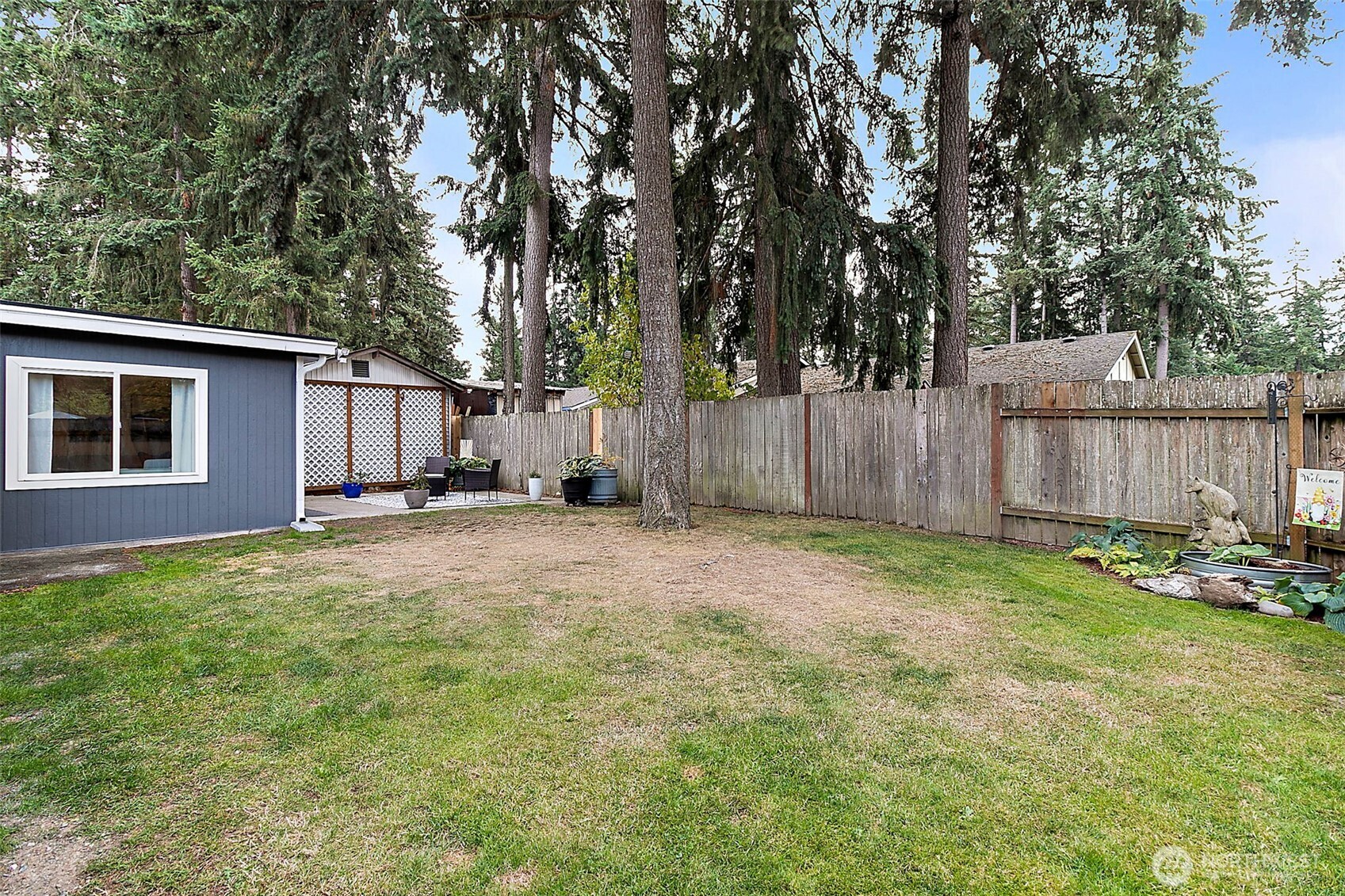 26104 195th Place Southeast Covington, WA 98042 - Photo 25 of 29 a backyard of a house with table and chairs