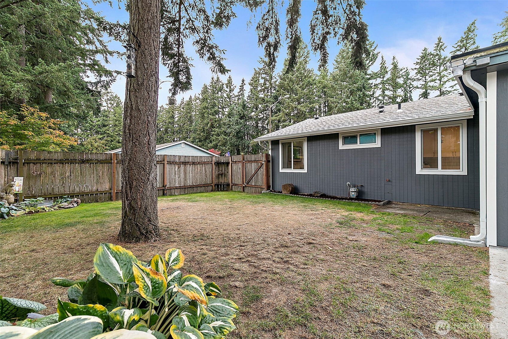 26104 195th Place Southeast Covington, WA 98042 - Photo 26 of 29 a house with trees in front of it
