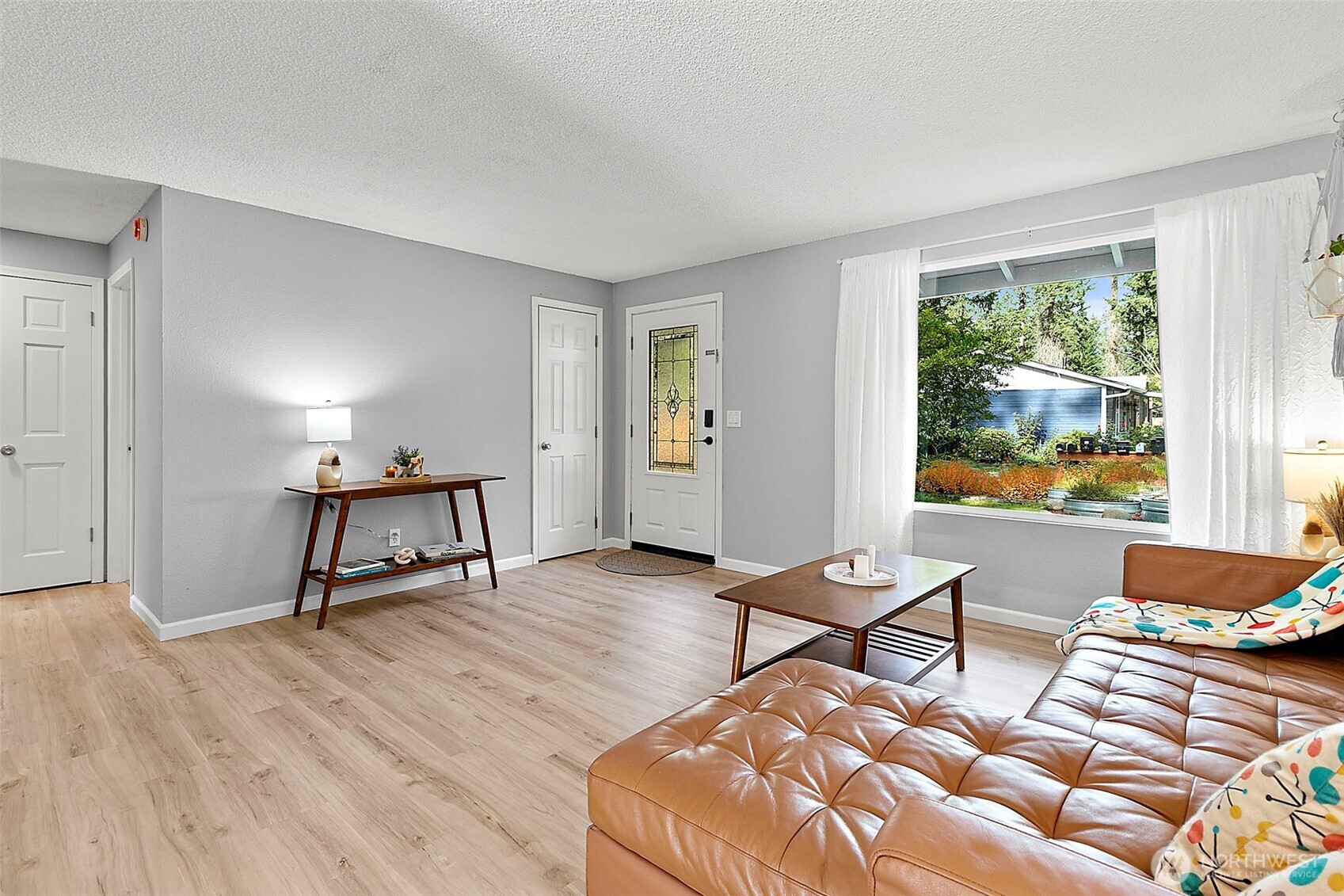 26104 195th Place Southeast Covington, WA 98042 - Photo 5 of 29 a living room with furniture and a window