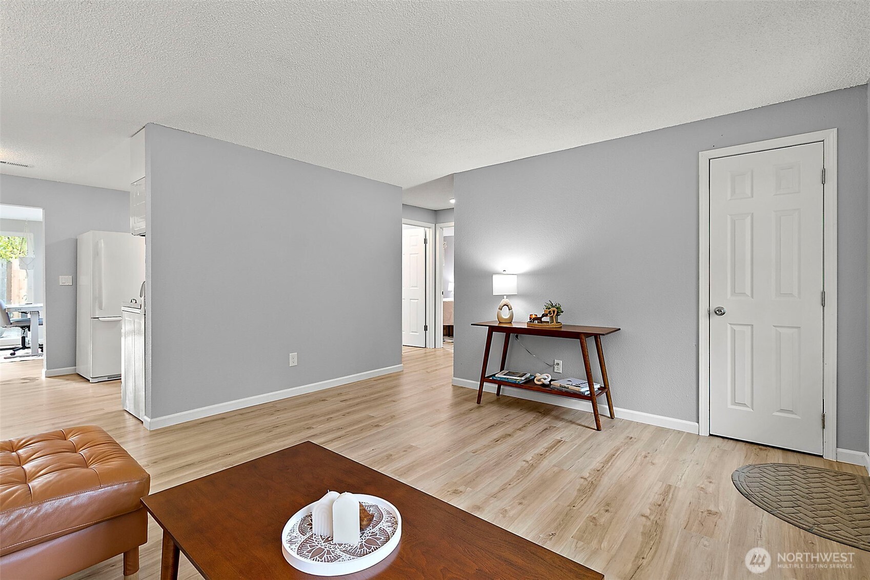 26104 195th Place Southeast Covington, WA 98042 - Photo 6 of 29 a living room with a couch and a dining table