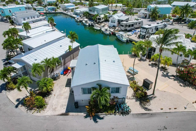 an aerial view of a house with garden space and street view