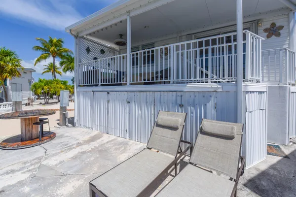 a view of a lake with sitting area