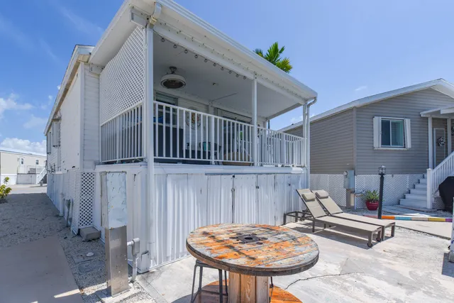 a view of a lake with furniture