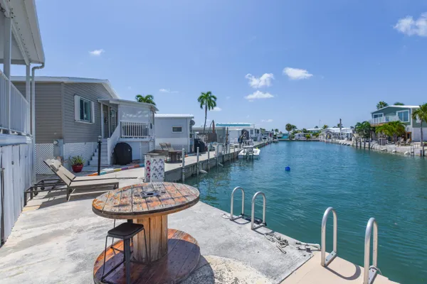 a view of a house with a flower garden