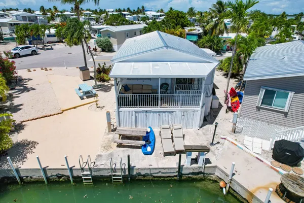 an aerial view of a house with a garden
