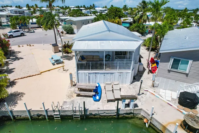 an aerial view of a house with a garden