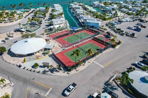a view of a street with a cars parked in front of it