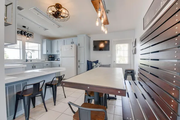a kitchen with a table and chairs