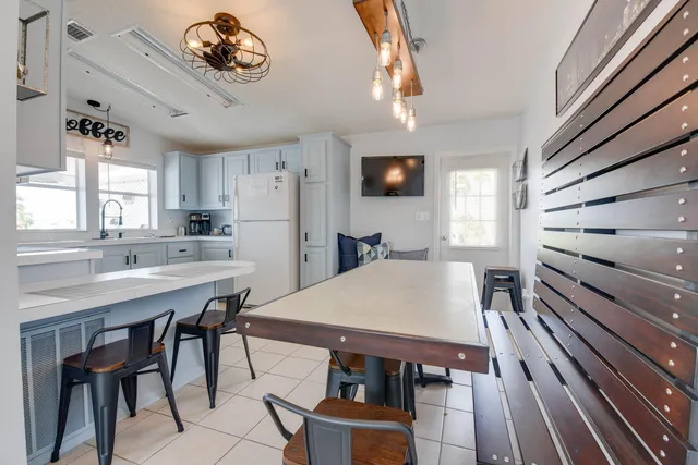 a kitchen with a table and chairs
