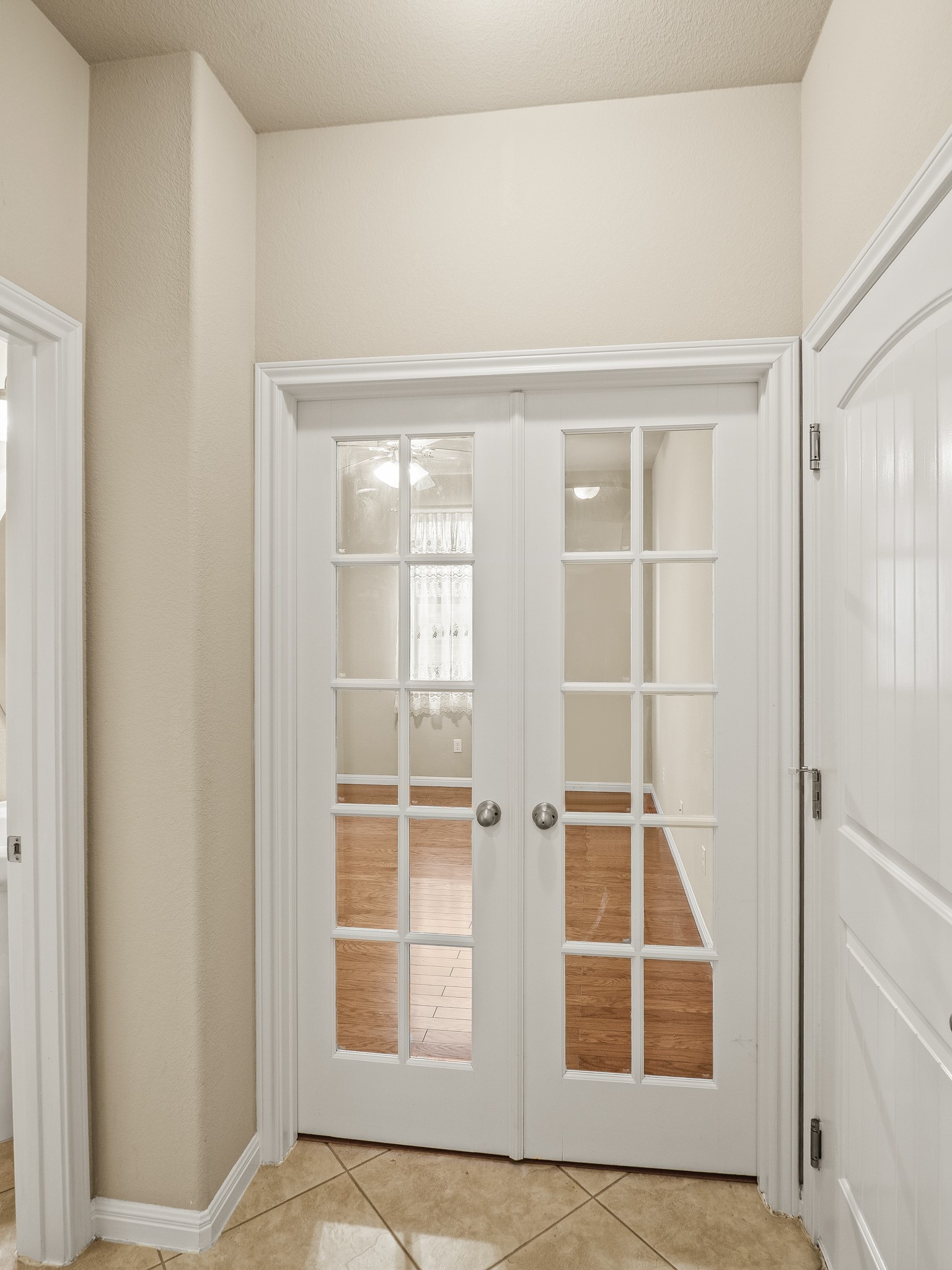 17805 Silent Harbor Loop Pflugerville, TX 78660 - Photo 14 of 34 a view of an empty room with wooden floor and a window