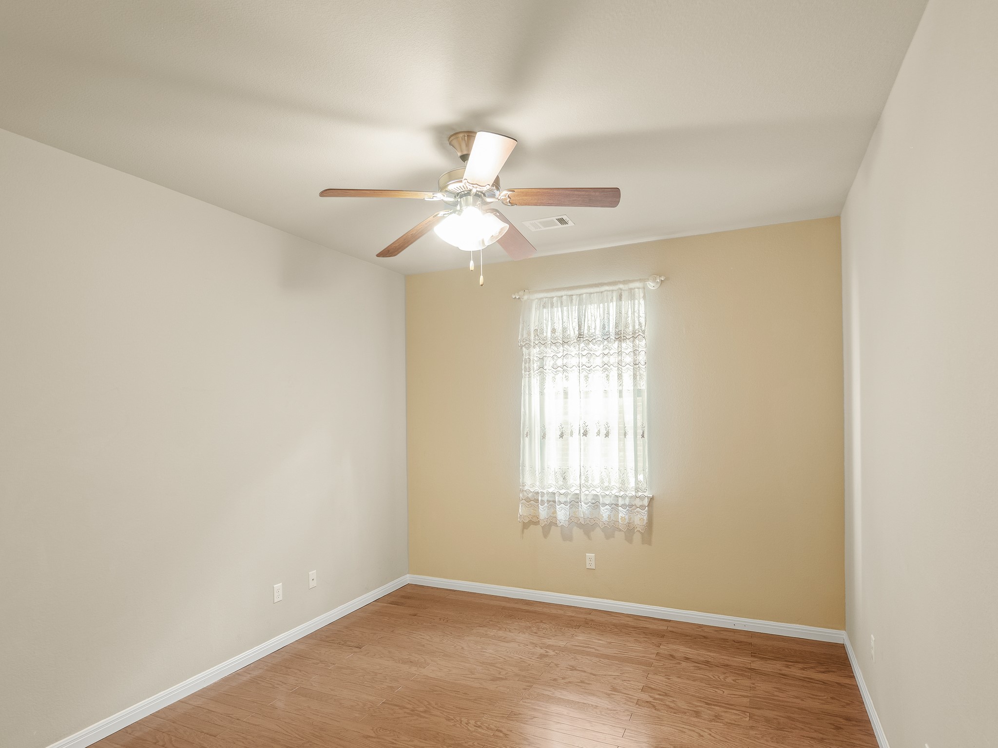 17805 Silent Harbor Loop Pflugerville, TX 78660 - Photo 22 of 34 an empty room with windows and fan