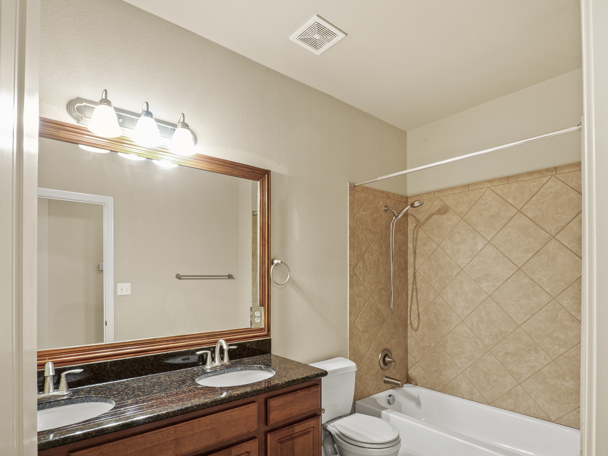 17805 Silent Harbor Loop Pflugerville, TX 78660 - Photo 23 of 34 a bathroom with a double vanity sink and a mirror