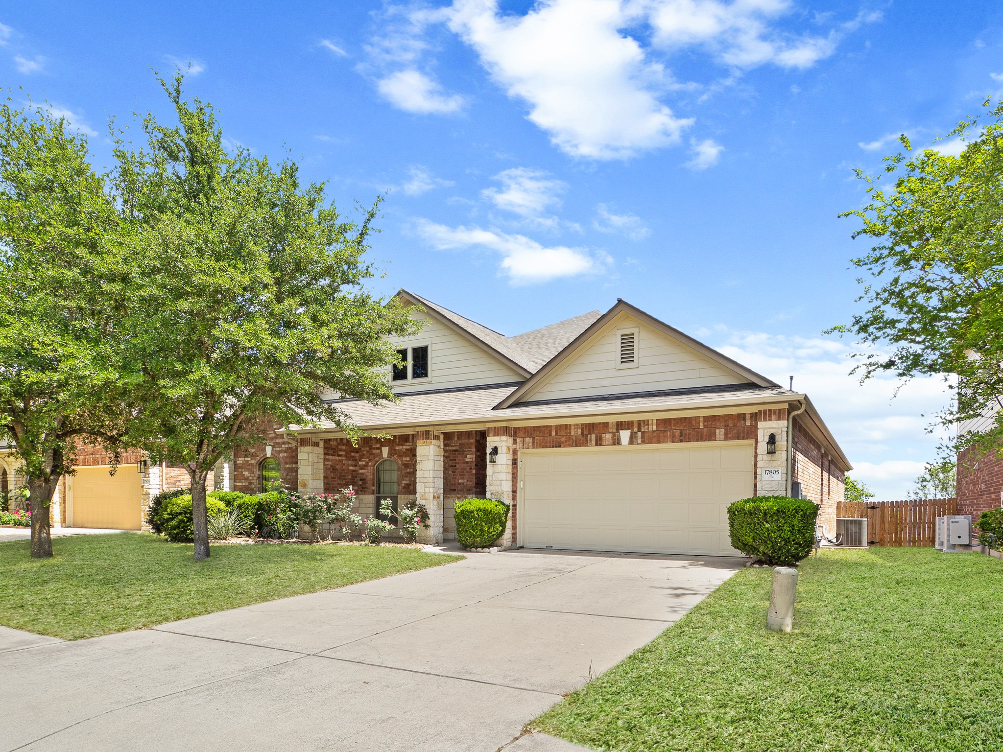 17805 Silent Harbor Loop Pflugerville, TX 78660 - Photo 28 of 34 a front view of a house with garden