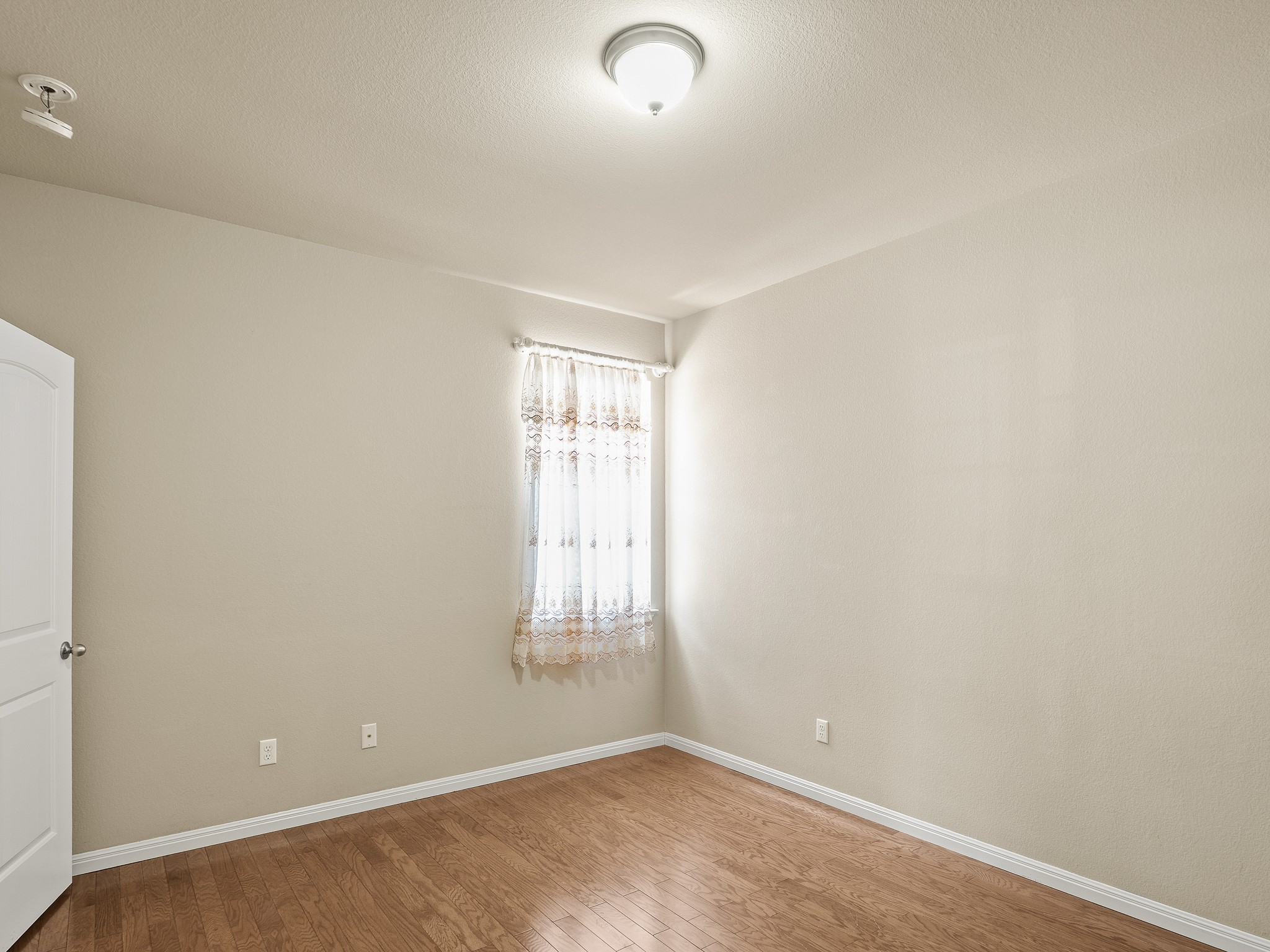 17805 Silent Harbor Loop Pflugerville, TX 78660 - Photo 32 of 34 an empty room with windows