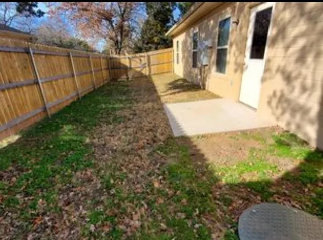 a view of a backyard with pathway