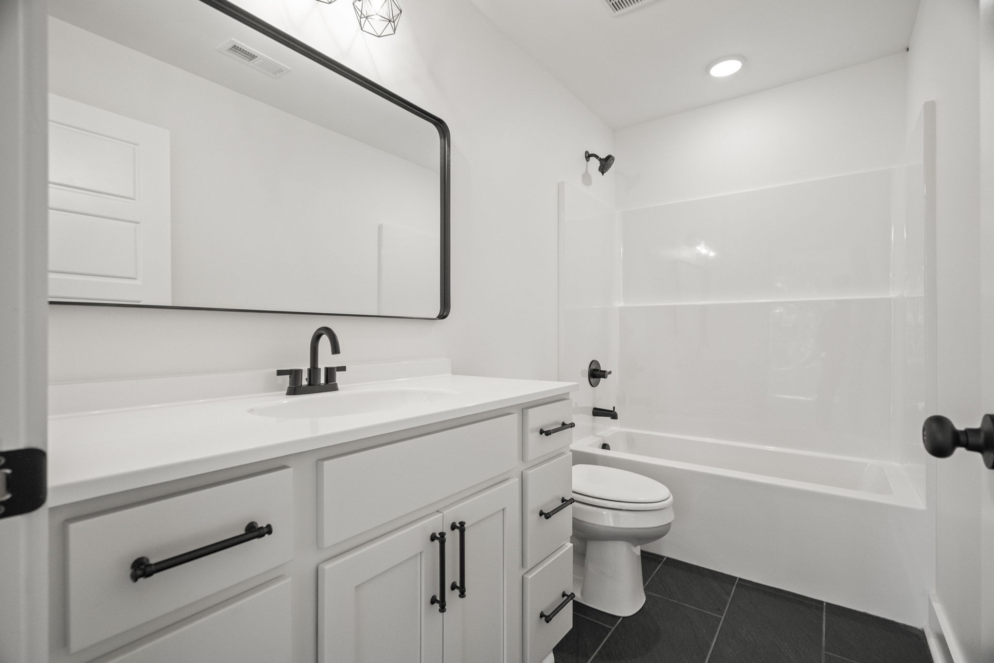 8104 Cedar Grove Road Cross Plains, TN 37049 - Photo 36 of 50 a bathroom with a sink a toilet and a mirror