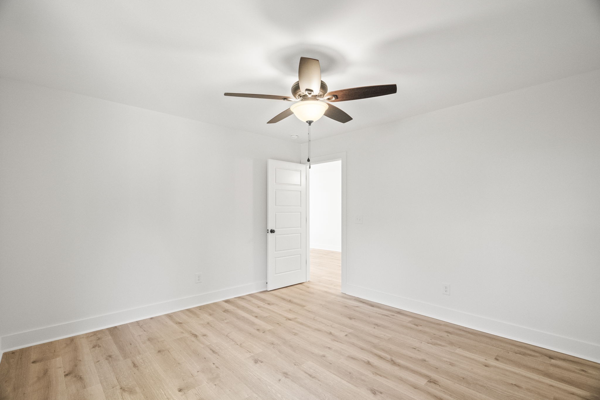 8104 Cedar Grove Road Cross Plains, TN 37049 - Photo 38 of 50 a view of a room with wooden floor and a ceiling fan