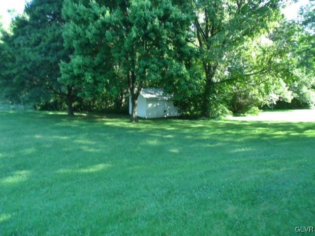 899 Engler Road Nazareth, PA 18064 - Photo 11 of 16 a view of a grassy field with trees in the background