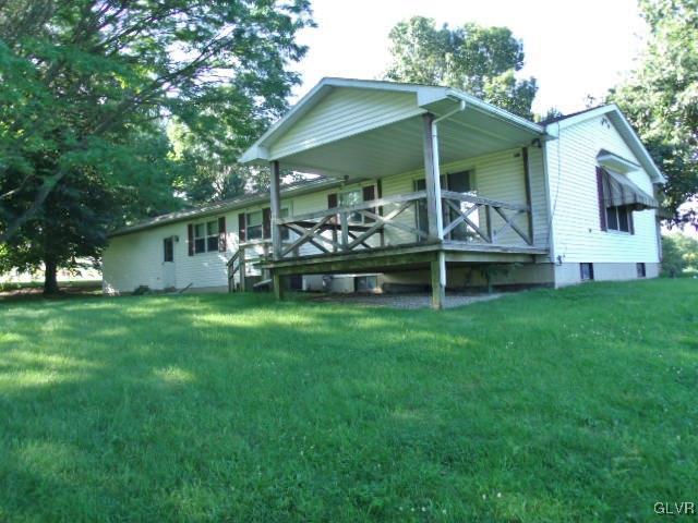 899 Engler Road Nazareth, PA 18064 - Photo 14 of 16 a view of a chair and tables in the back yard of the house
