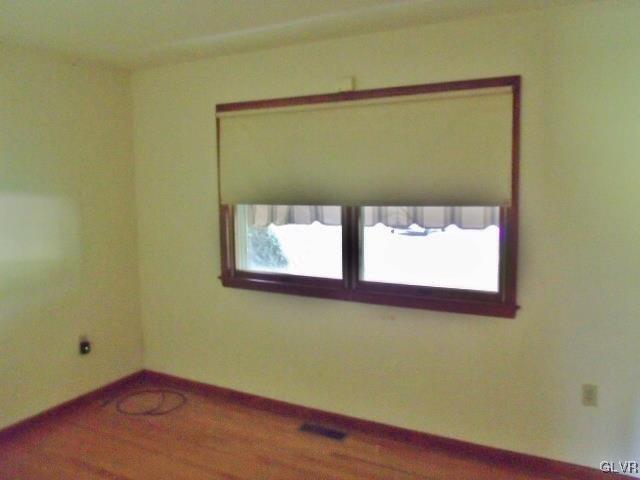899 Engler Road Nazareth, PA 18064 - Photo 7 of 16 a view of a small room with wooden floor and a window