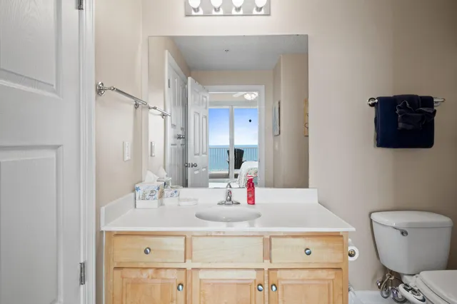 a dining room with furniture and a floor to ceiling window