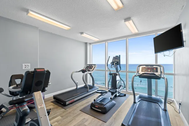 a living room with furniture with kitchen countertops and stairs