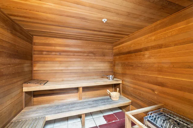 a view of swimming pool with outdoor seating and city view