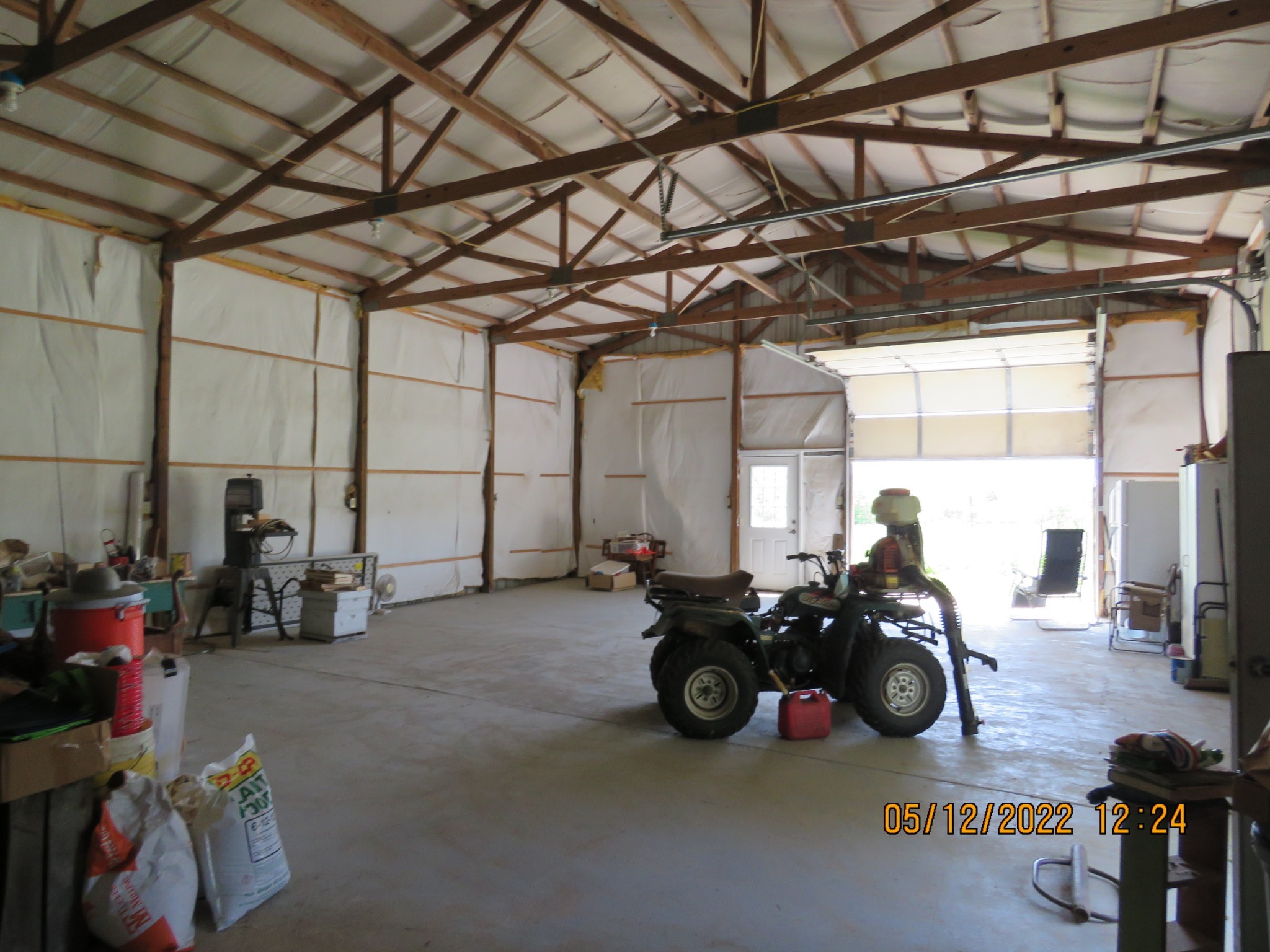 1689 Meister Hills Road Deer Lodge, TN 37726 - Photo 14 of 19 a view of a garage with a car and a wine table