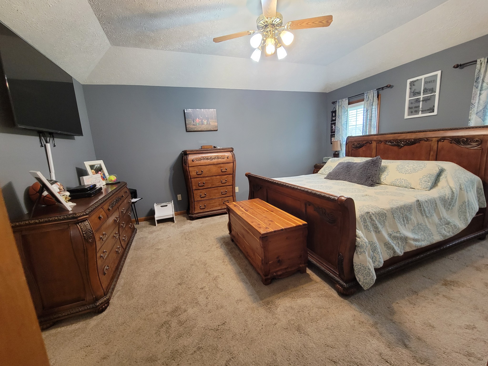 249 Wakefield Drive Manchester, TN 37355 - Photo 15 of 46 a bedroom with a bed and a flat screen television