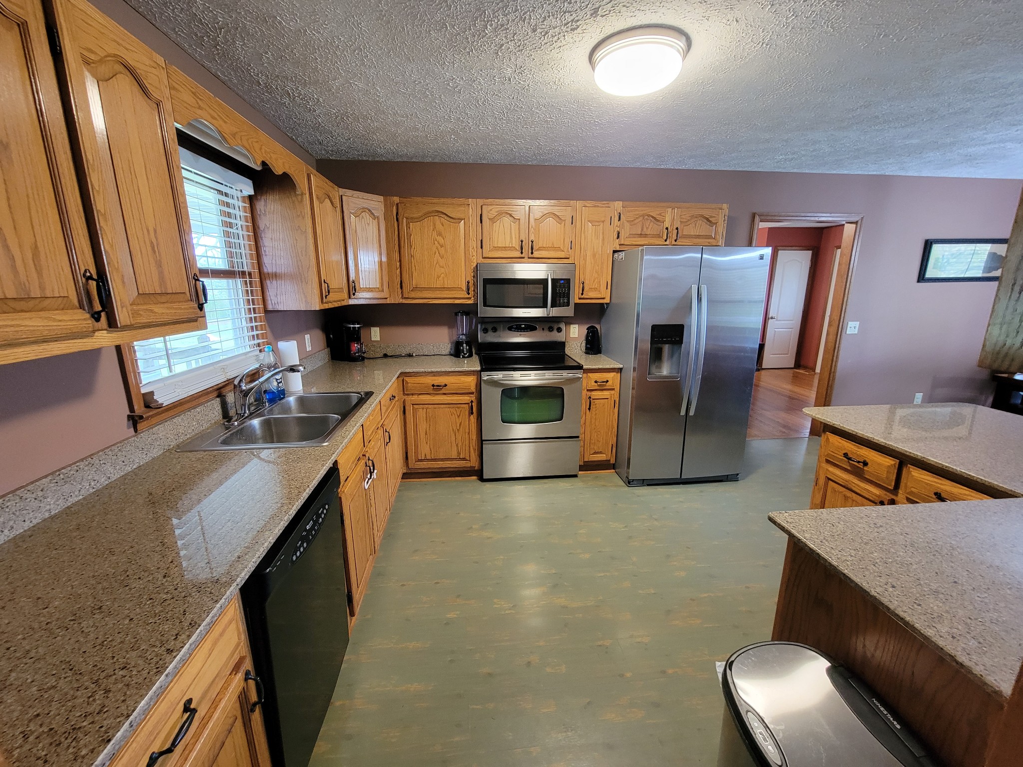 249 Wakefield Drive Manchester, TN 37355 - Photo 32 of 46 a kitchen with refrigerator and cabinets