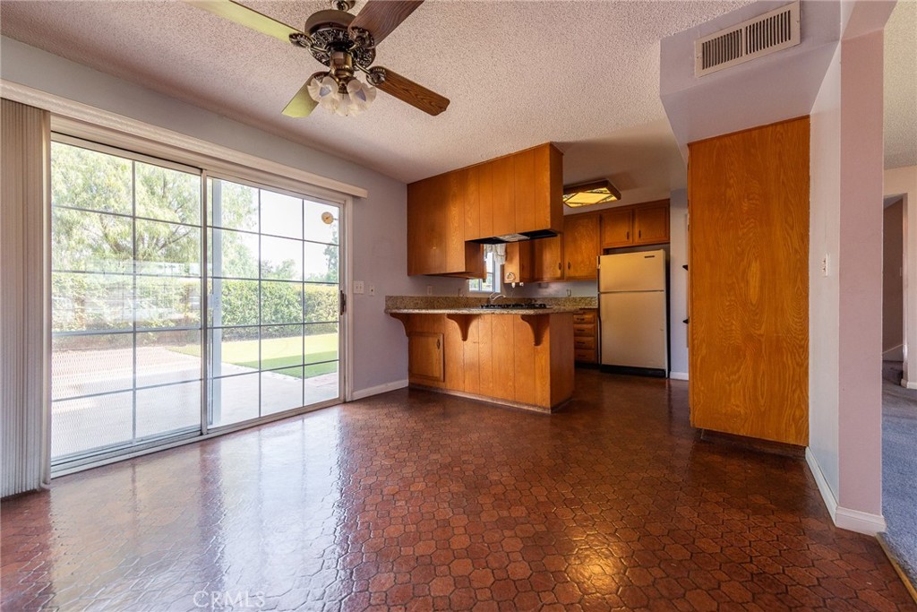 5171 Merrill Avenue Riverside, CA 92504 - Photo 12 of 34 a view of a kitchen with a sink and a window