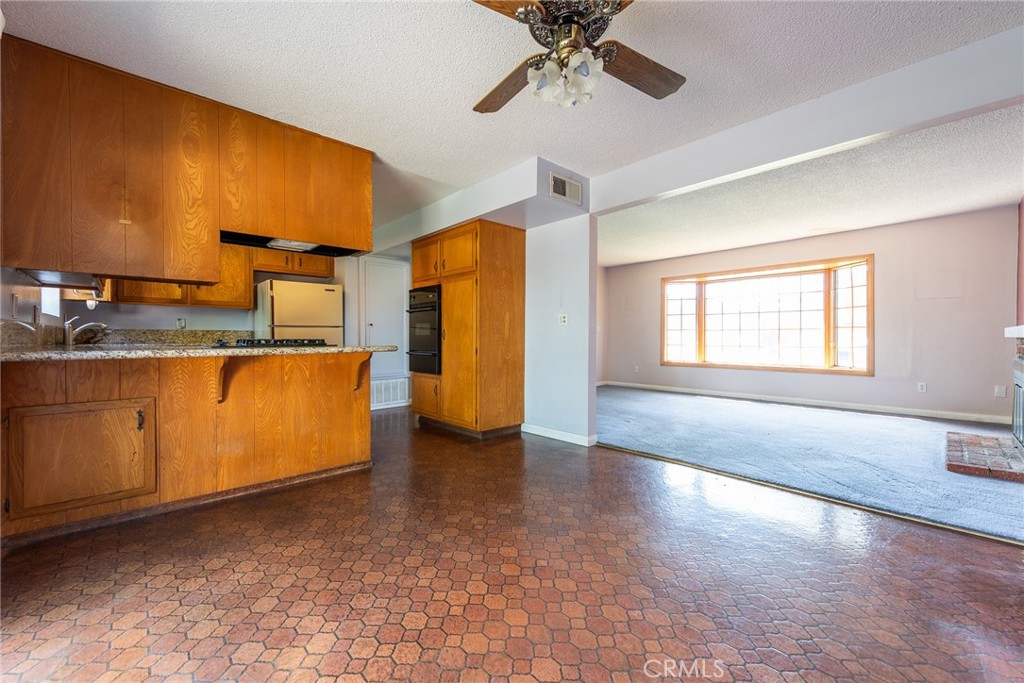 5171 Merrill Avenue Riverside, CA 92504 - Photo 13 of 34 a view of a kitchen with a sink and a window