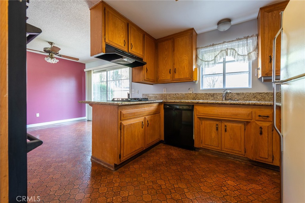 5171 Merrill Avenue Riverside, CA 92504 - Photo 16 of 34 a kitchen with a sink cabinets and window