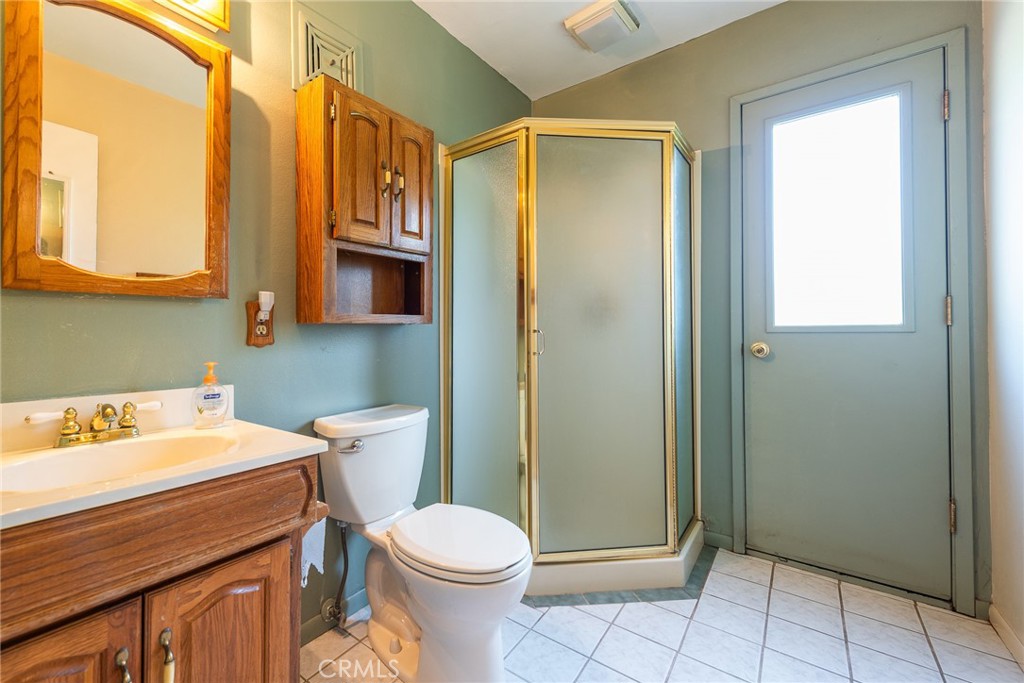 5171 Merrill Avenue Riverside, CA 92504 - Photo 18 of 34 a bathroom with a sink a toilet and shower