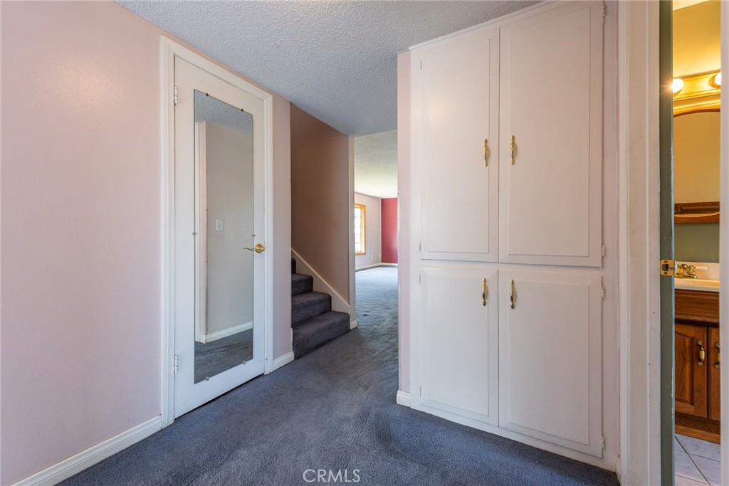 5171 Merrill Avenue Riverside, CA 92504 - Photo 24 of 34 a view of a bedroom from a hallway