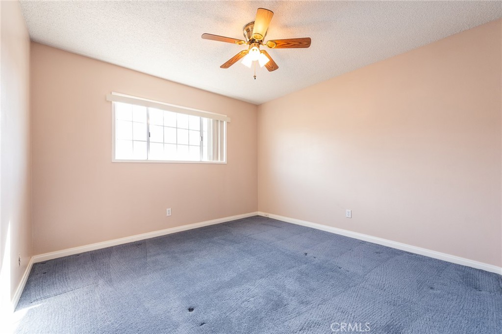 5171 Merrill Avenue Riverside, CA 92504 - Photo 28 of 34 an empty room with closet and a chandelier fan