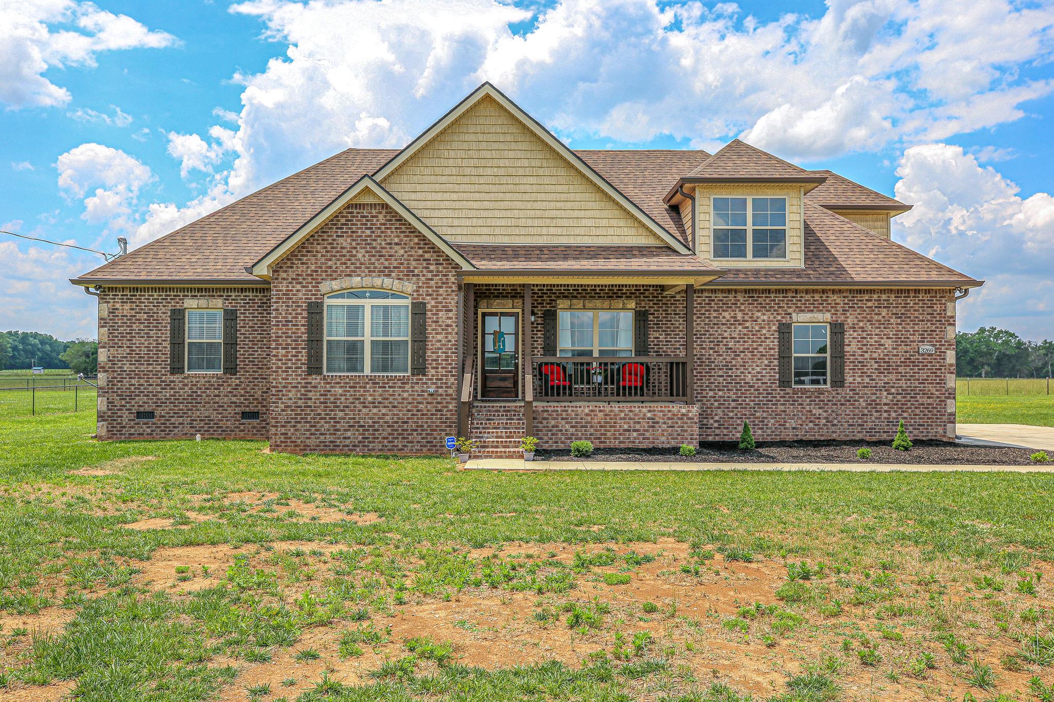 a front view of a house with a yard