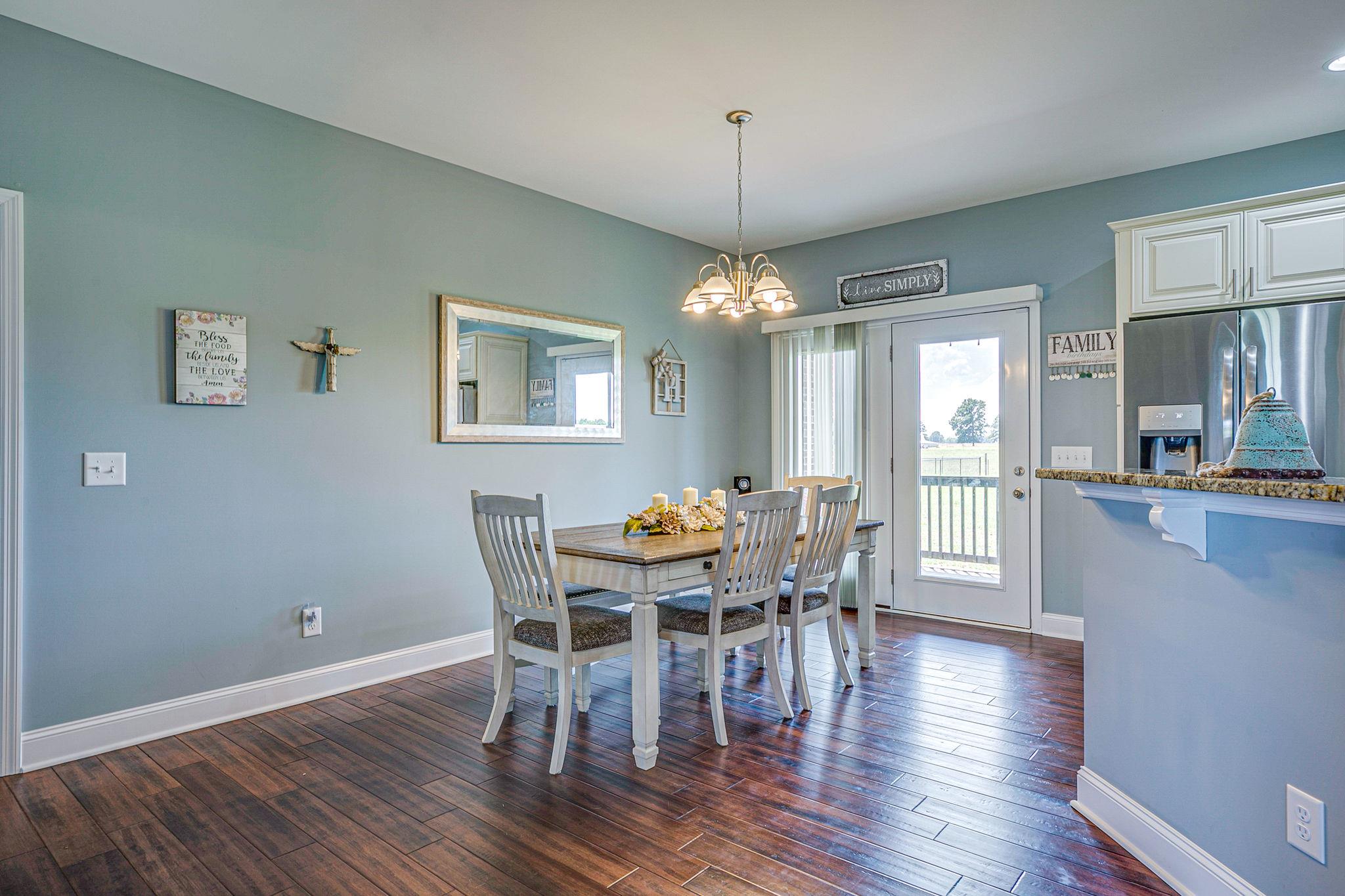 3269 Midland Road Bell Buckle, TN 37020 - Photo 11 of 30 a view of a dining room with furniture window and wooden floor