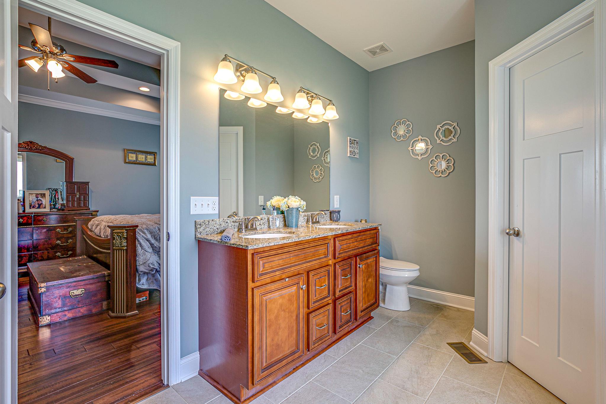 3269 Midland Road Bell Buckle, TN 37020 - Photo 20 of 30 a room with a mirror and a sink