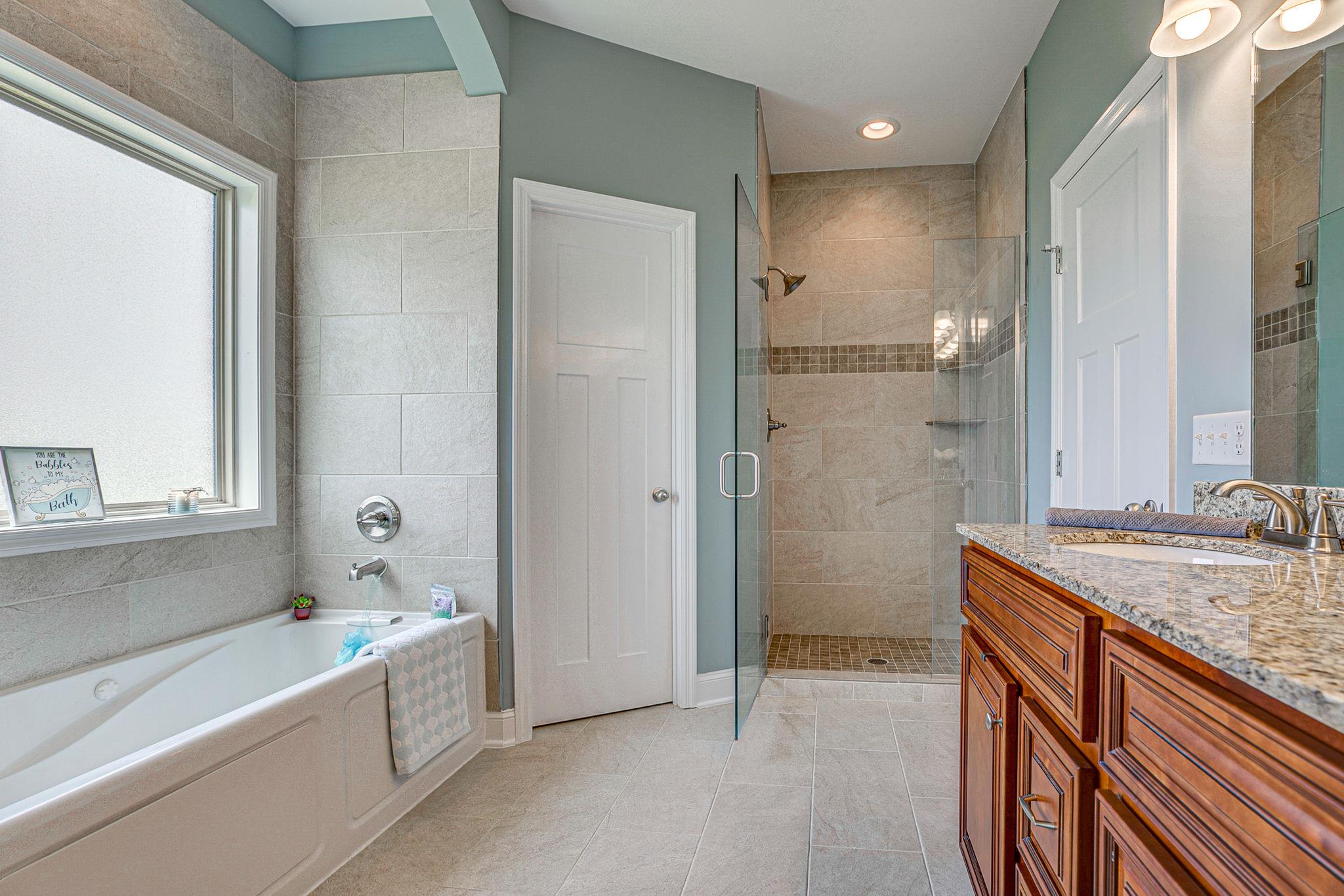 3269 Midland Road Bell Buckle, TN 37020 - Photo 21 of 30 a bathroom with a granite countertop sink mirror and a bathtub