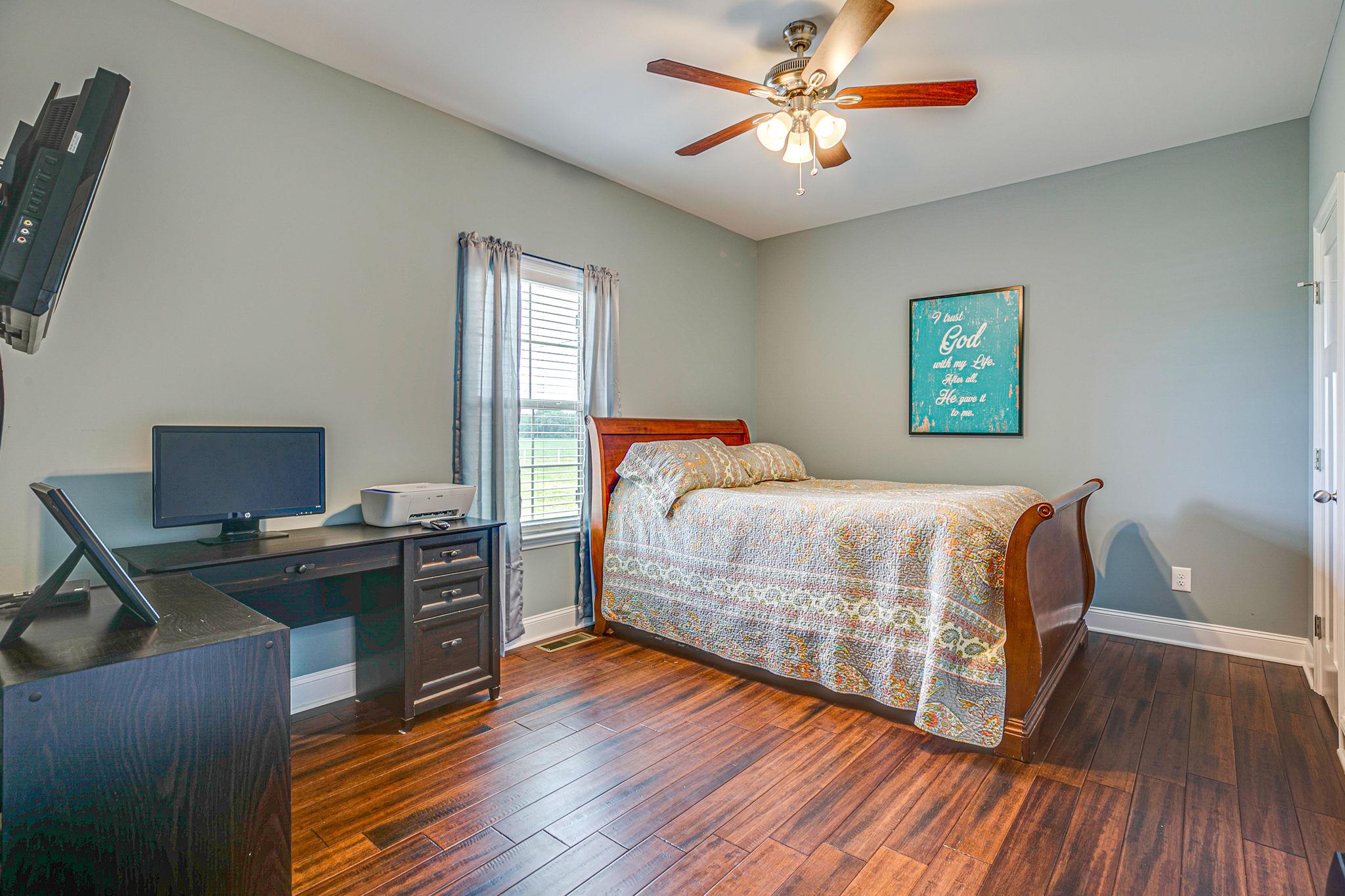 3269 Midland Road Bell Buckle, TN 37020 - Photo 22 of 30 a bedroom with a bed and a desk