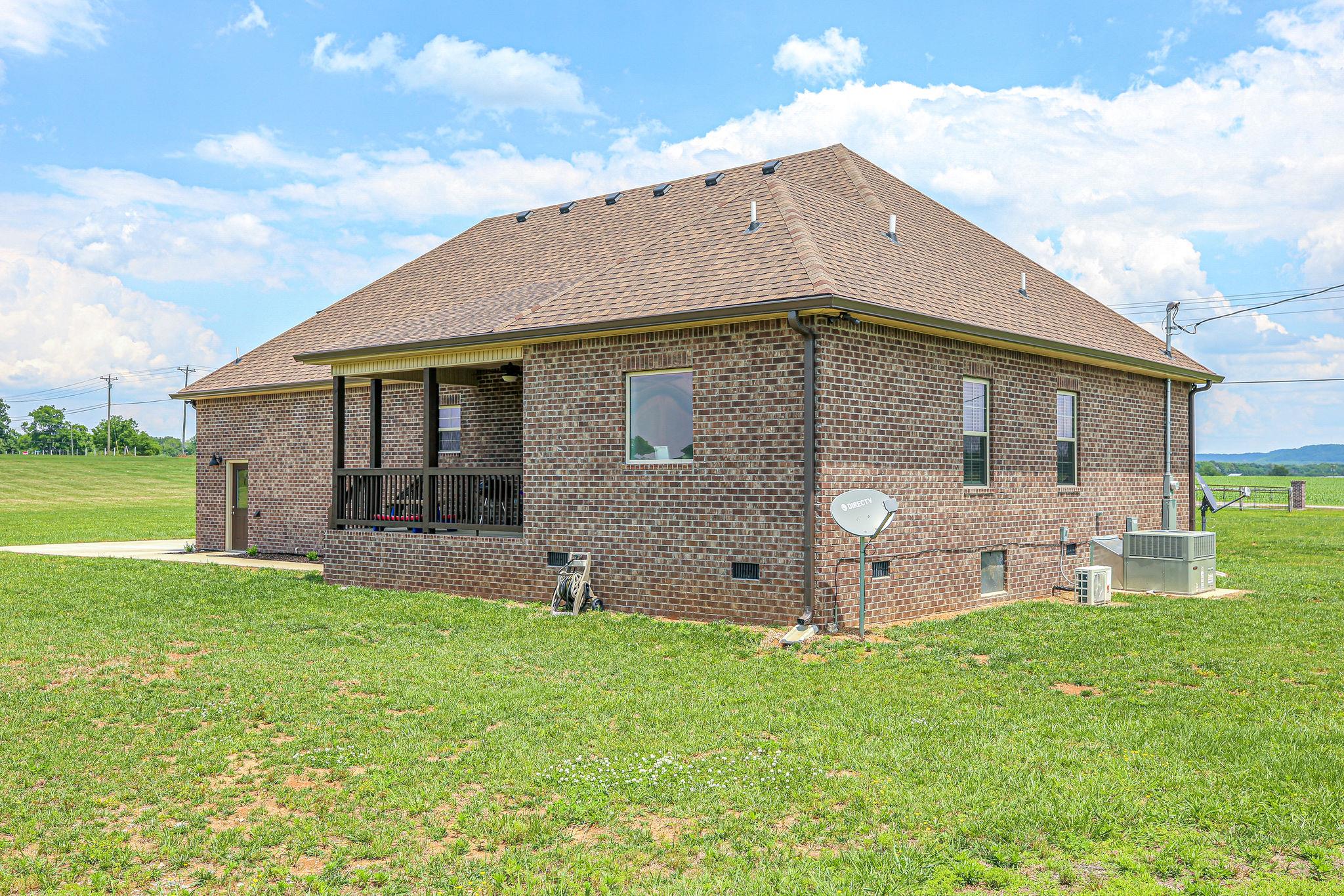 3269 Midland Road Bell Buckle, TN 37020 - Photo 26 of 30 a view of a house with a yard and sitting area