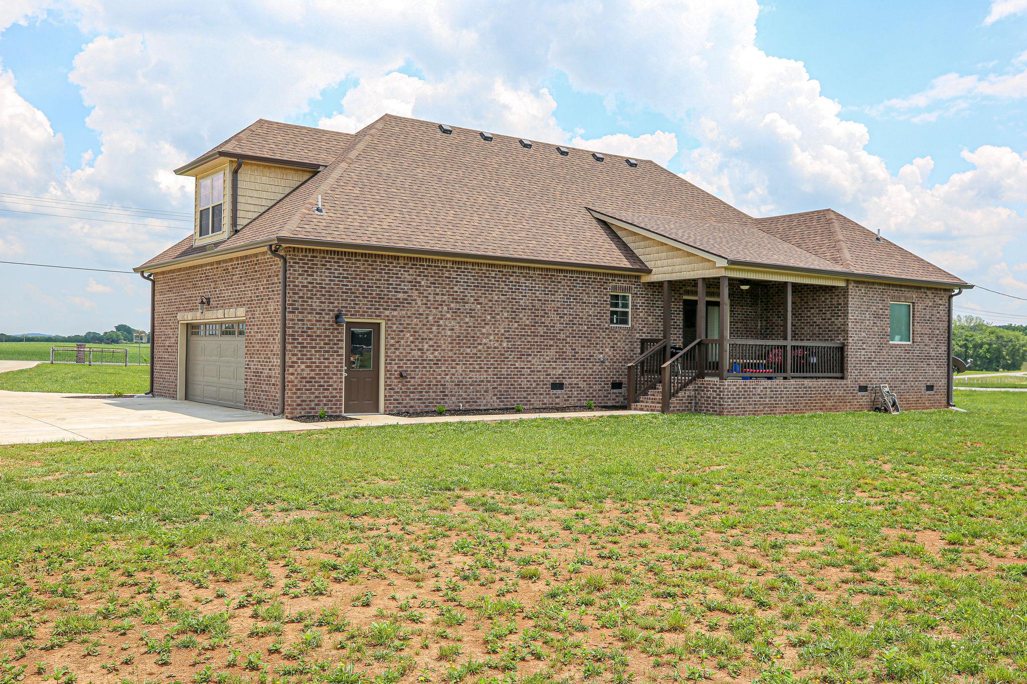 3269 Midland Road Bell Buckle, TN 37020 - Photo 28 of 30 a front view of a house with a yard