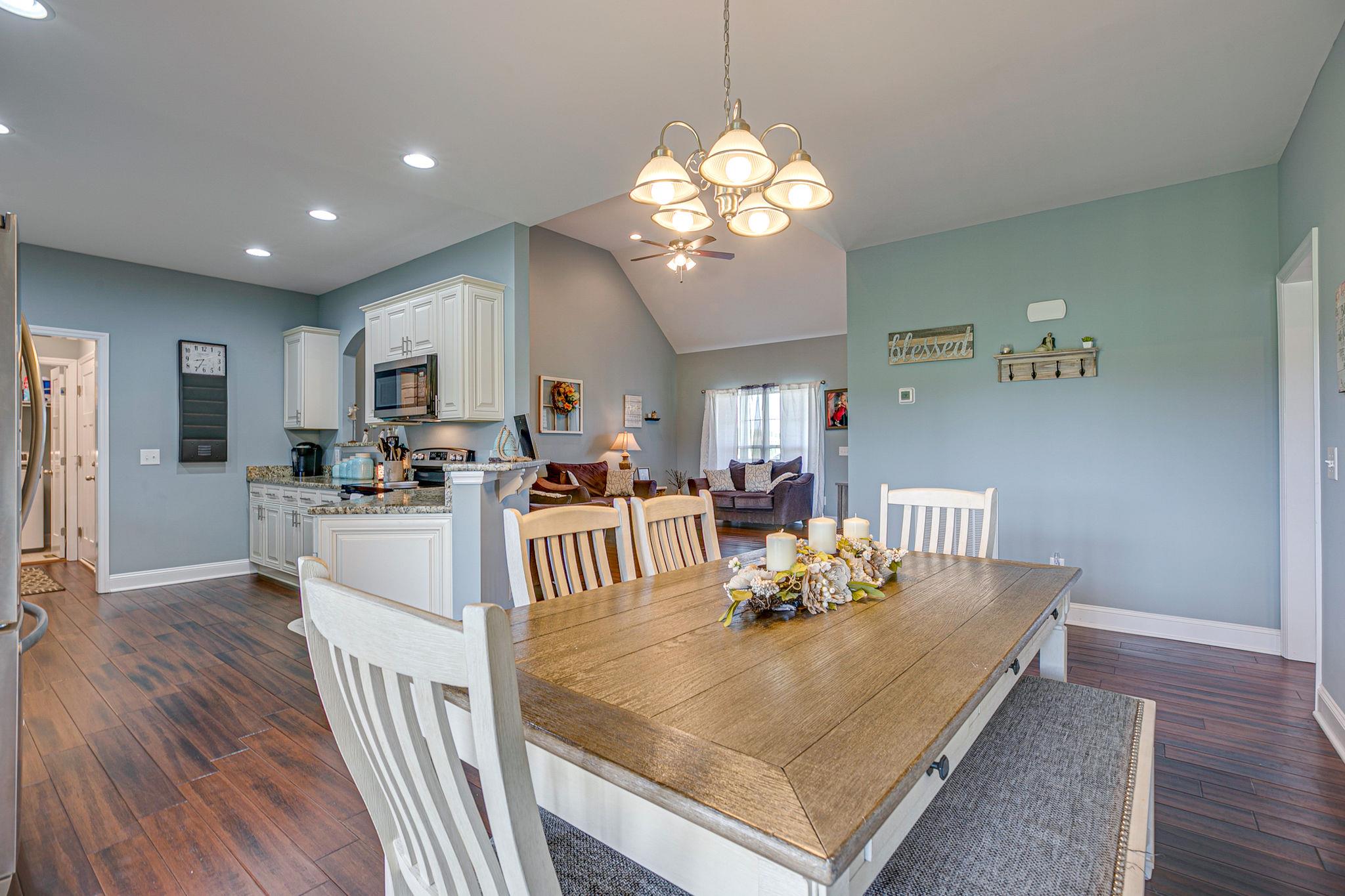 3269 Midland Road Bell Buckle, TN 37020 - Photo 10 of 30 a view of a dining room with furniture and wooden floor