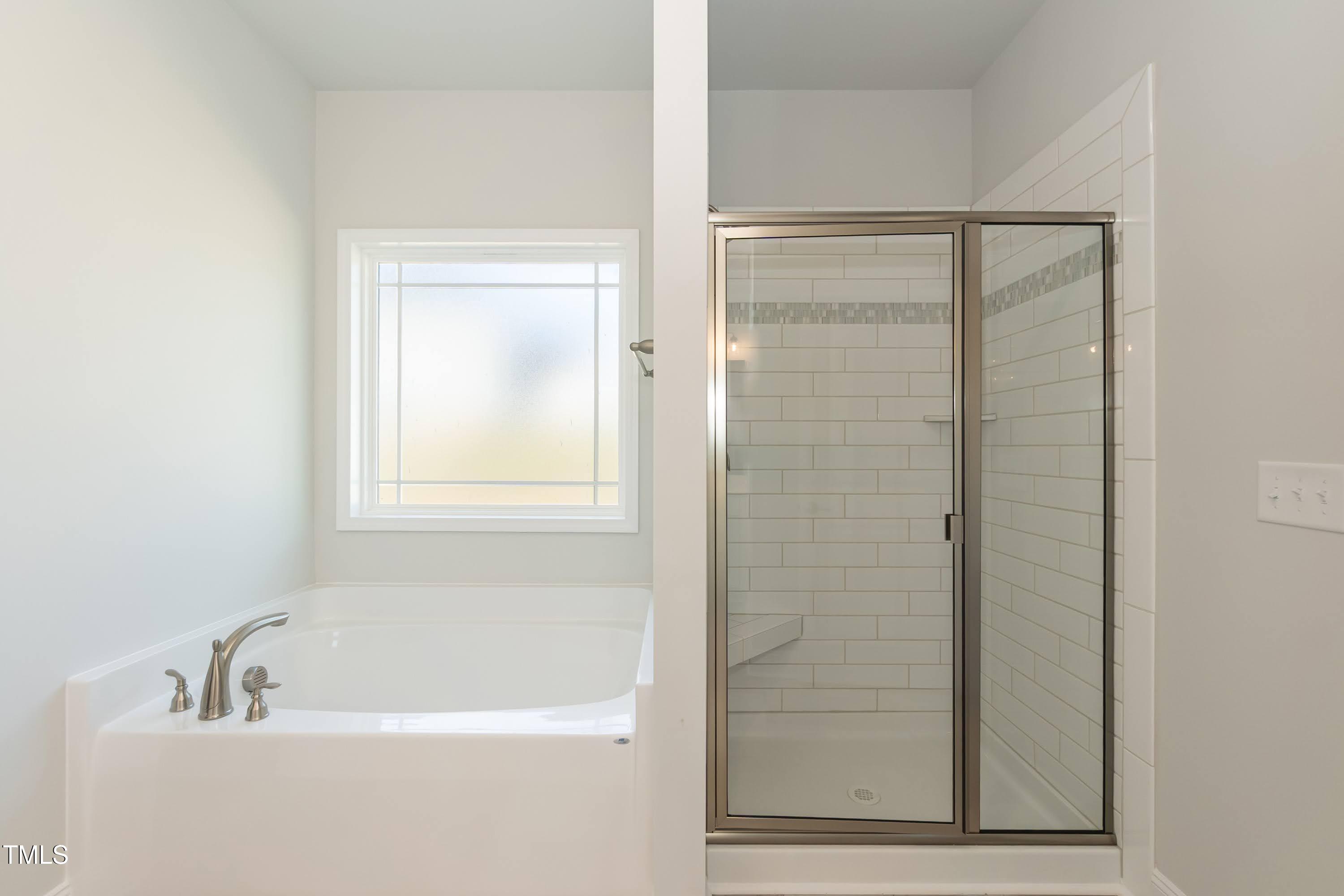 56 Braddock Court Garner, NC 27529 - Photo 21 of 55 a bathroom with a bathtub
