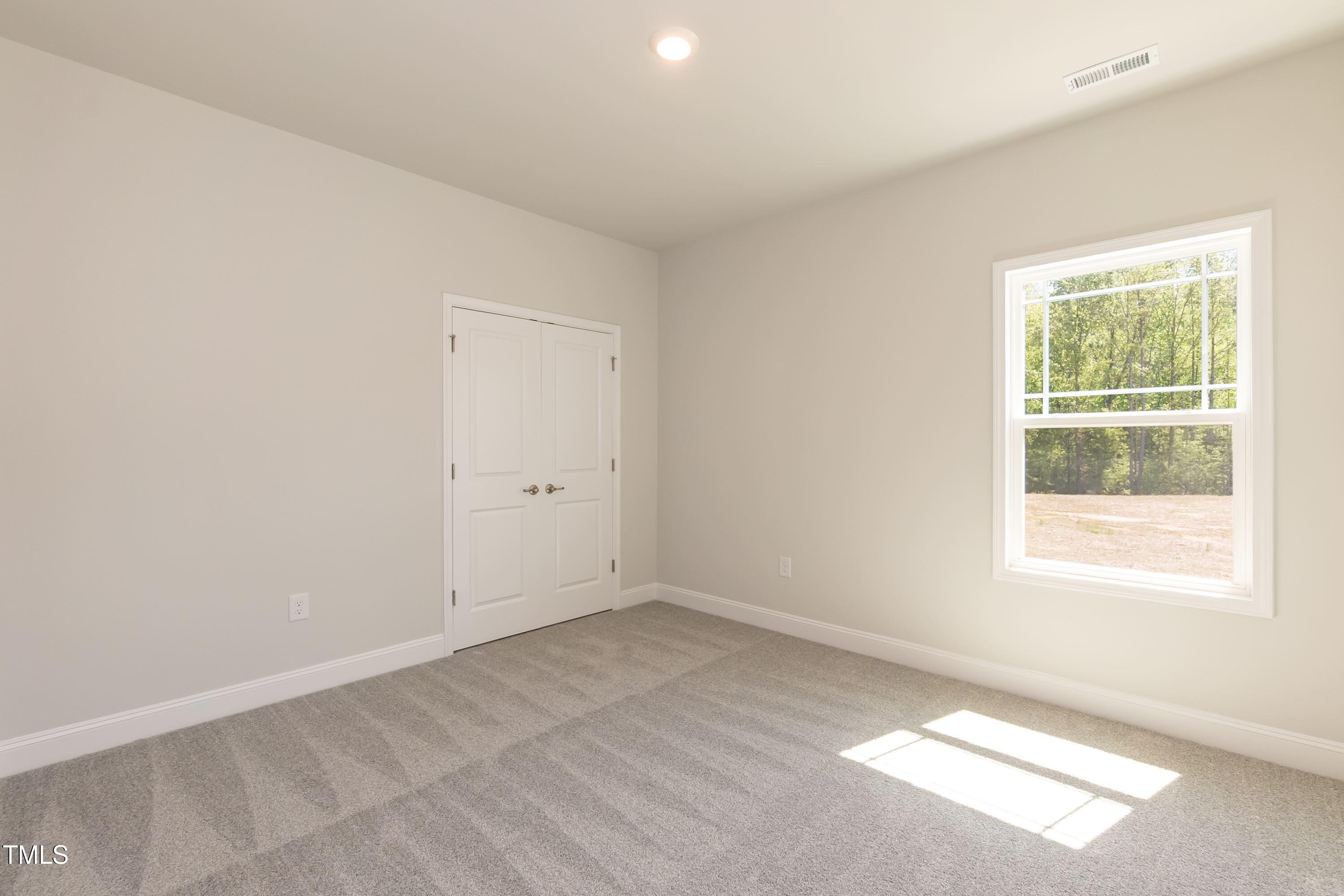 56 Braddock Court Garner, NC 27529 - Photo 24 of 55 an empty room with a window